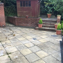 Before we pressure washed a patio area. The slabs looked grey.